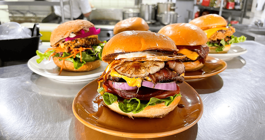 Delicious gourmet burgers with fresh ingredients at The Moody Chef.